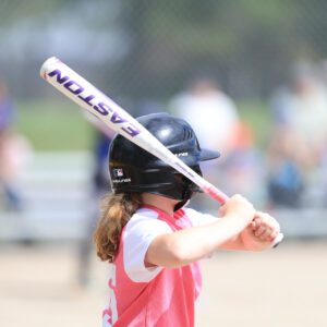 girl playing baseball